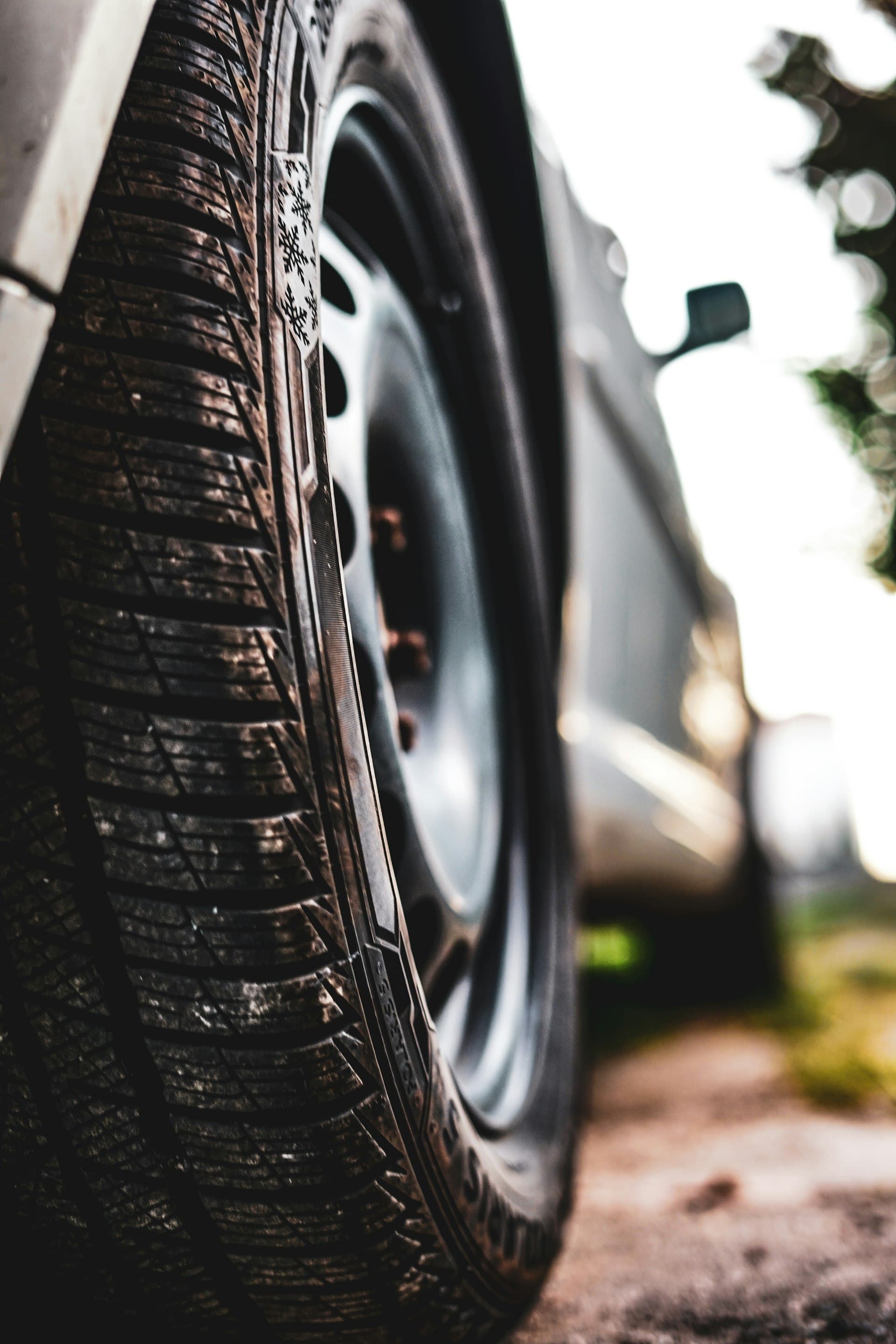 Moody close-up of a car tyre at night